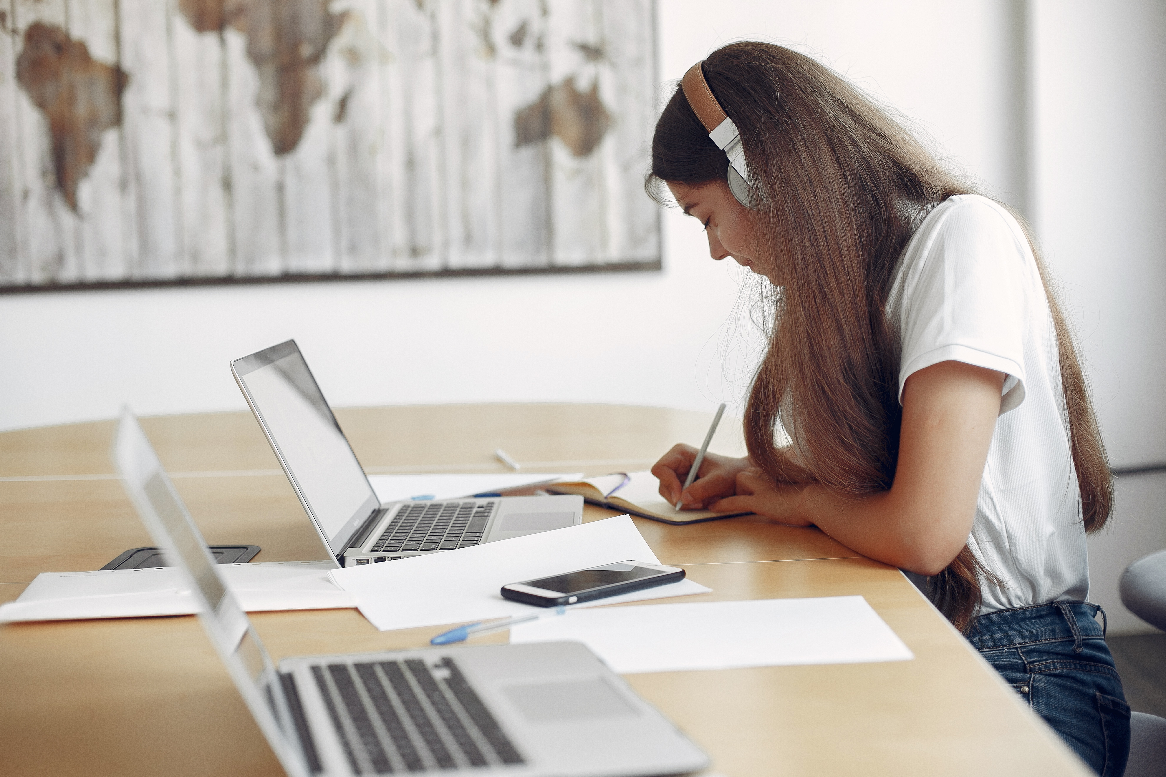 Young student sitting table use laptop